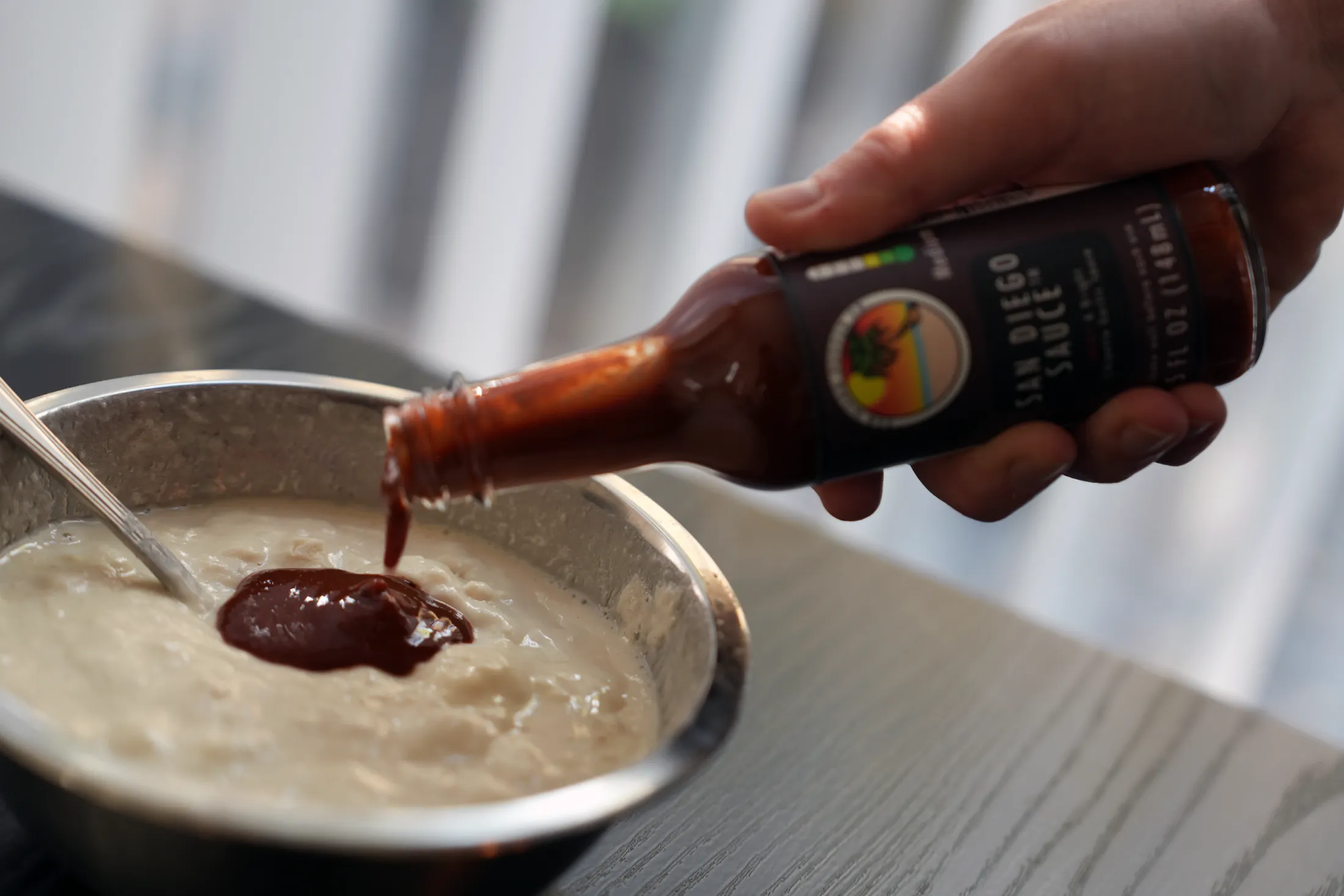 San Diego Sauce being poured into beer batter for authentic San Diego Fish Tacos